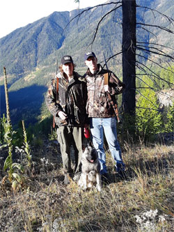 Chris and his son in Canada with Tucker
